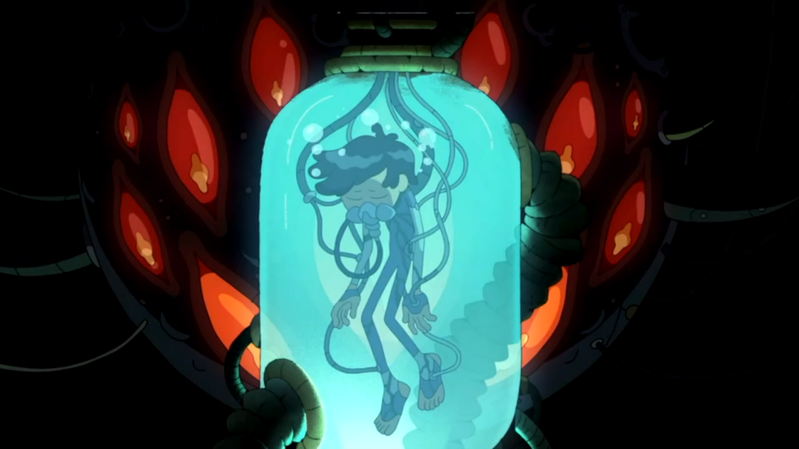 Marcy floats in a glass tube, hooked up to tubes and wires, eyes closed, breathing. The Core, a massive spherical mechanical creature behind Marcy, gazes at him with eleven large red eyes.